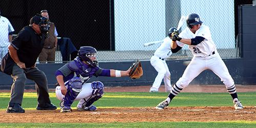 Senior Alfonso Bafidis prepares to swing his bat on Feb. 19.
