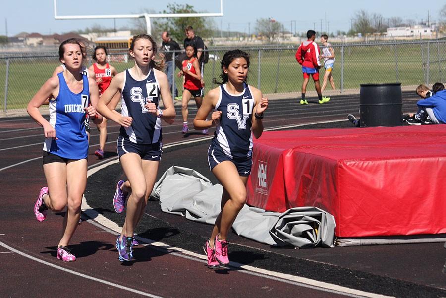 Grace Hannemann and Marisa Ibarra compete in the 3200 meter run.