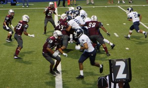 Senior Derek Housler dodges through the Midland Rebel’s defensive line.