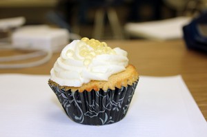 Andie O'Brien's pineapple upside down cupcake with rum and coconut frosting and honey pearls.