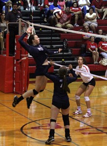 Successful Spike: Senior Kainah Williams spikes the ball against Antonian Sept. 1. The girls completed the game with a score of 3-0.