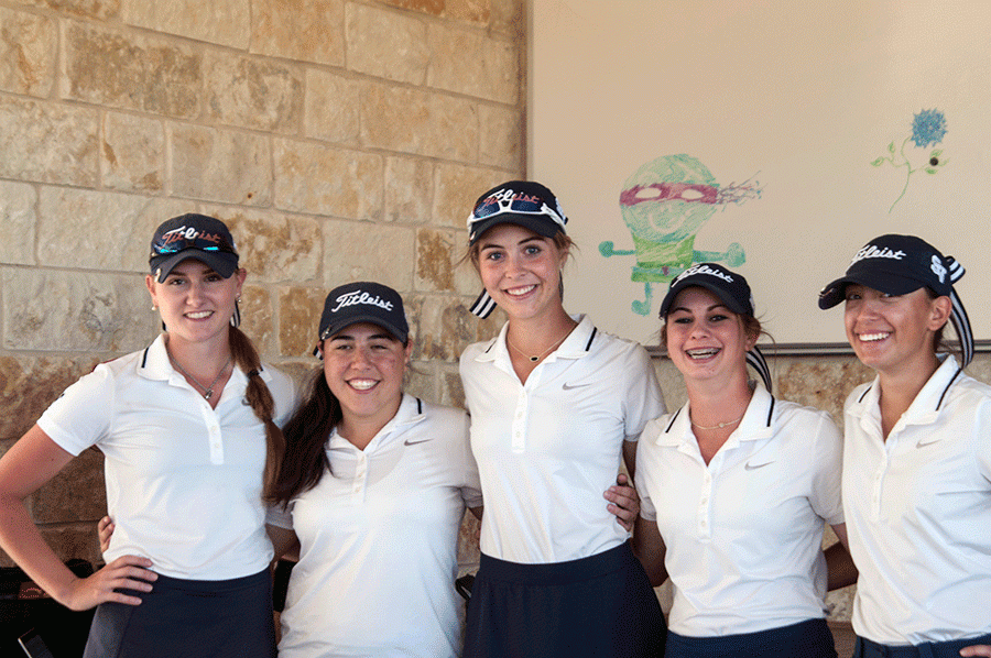 The girls' golf team stands together after the district tournament. 