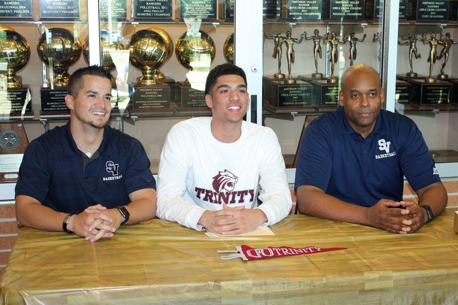 Coach Myke Ortiz, senior Tyler Peavy and Coach Ike Thornton