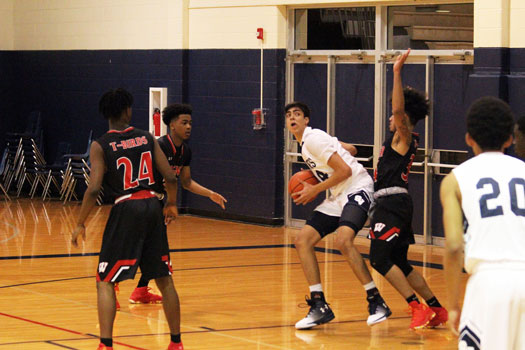Senior Alex Peavy works in the post against a Wagner defender in the teams meeting from last season. 
