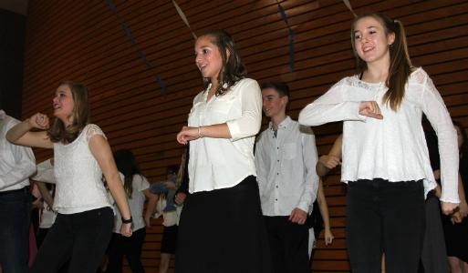 At the 2016 Dinner and a Song, senior Madelyn Deviney and freshmen Amanda Charlton and Bethany Kleck dance to the music.