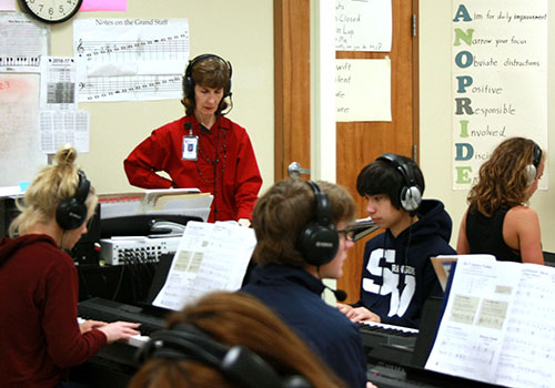 Gwen Gabriel instructs her piano class. 
