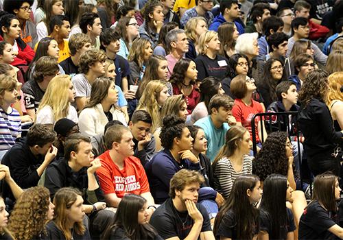 Juniors and seniors watch the mock memorial service.