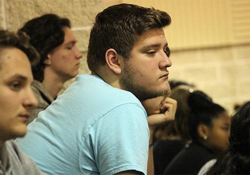 Senior Garren Pickett listens intently at the assembly.