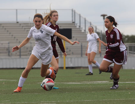 Junior midfielder Kaitlyn Bumgarner pushes the ball downfield in the teams 8-0 victory at home against Callallen on Jan 5.
