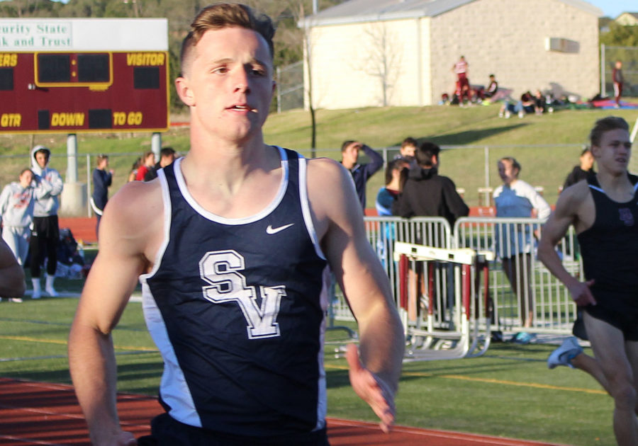 Senior Chandler Beam running 4x400m relay on Feb. 25.