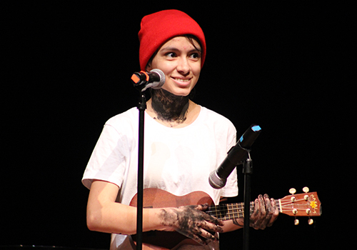 Victoria Quinones plays ukelele while her accompanist Sophia Sauceda keeps the beat on a box in the 2017 talent show.