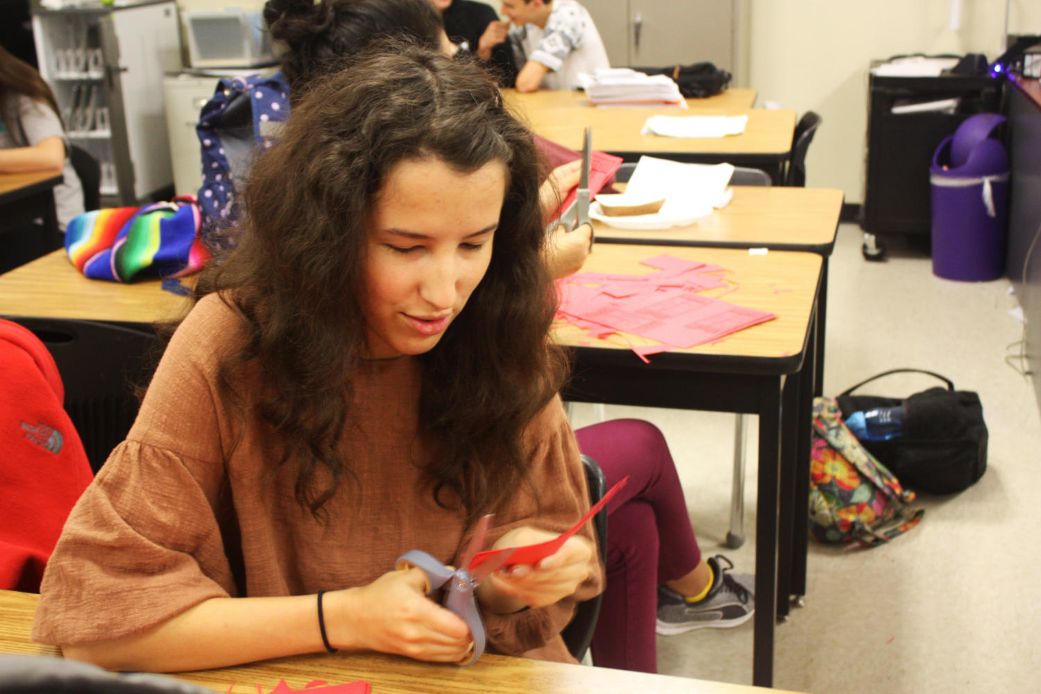 Senior Madison Panzarella prepares admission tickets Friday afternoon.