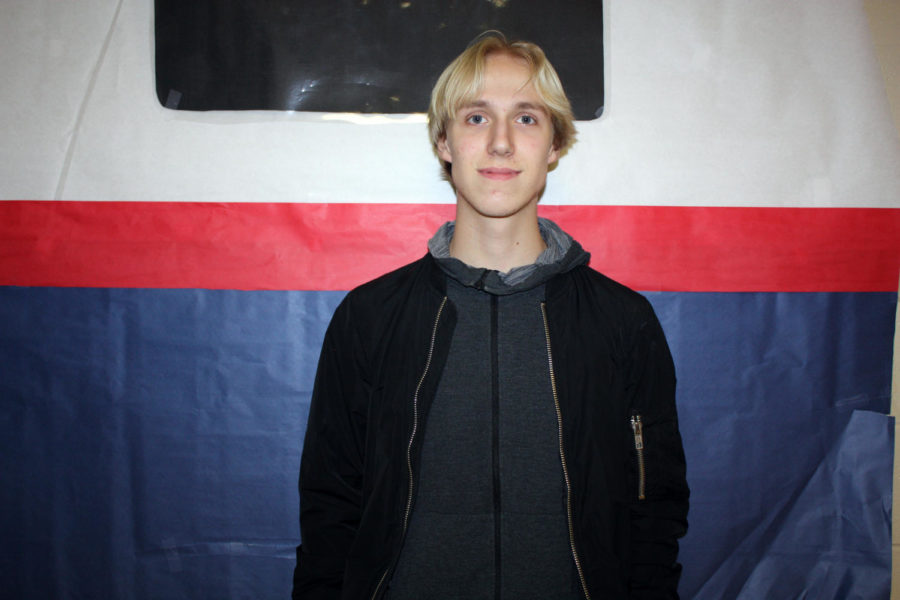 NEXT STOP, TEXAS Junior Jesper Steenholdt poses for the camera outside of Mr. Mckinley, the debate coach’s, classroom. Steenholdt first came to America Aug. 9. where he stayed in New York until the 12. (Photo by Makalya Kyner)