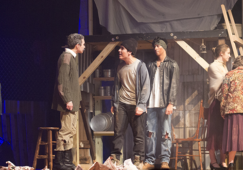 LJ Haider as Lord Capulet argues with Elf Synodinos as Tybalt and Alan Solis as Petruchio because they see Romeo, a Montague, at the feast.