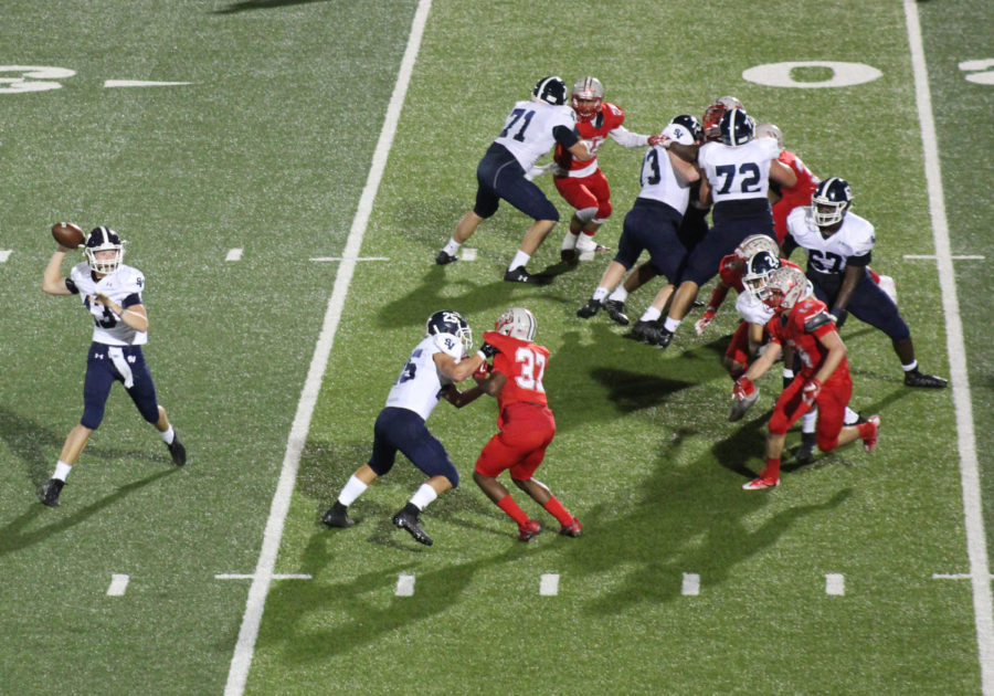 Protected by his offensive line, junior QB Levi Williams drops back in the pocket to pass during the football team's thrilling 40-37 overtime victory over Judson.