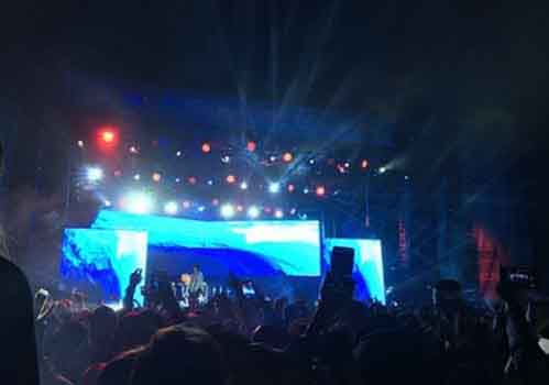 Wiz Khalifa sings on the left stage of the two Saturday night. The crowd recorded and sang along as they watched.