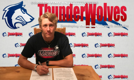 Senior defensemen Brance Anderson signing commitment to play at Colorado State University Pueblo on Nov. 8. 
