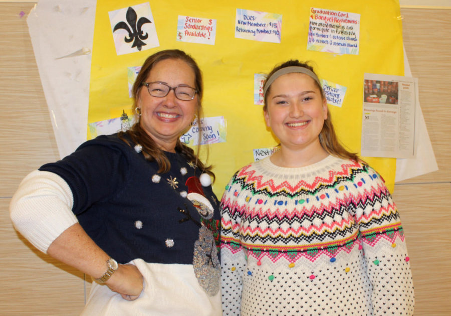 Madame Hinsch and freshman Aubri Bain pose for the camera in A wing.