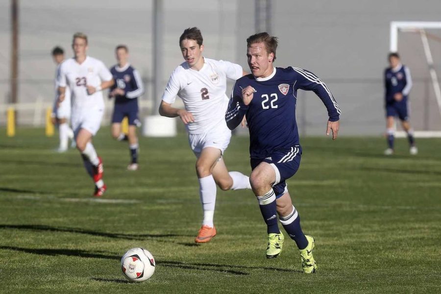 Senior midfielder, Cord Sabbatini sprinting past defenders to beat Glenn 4-1 on January 5.