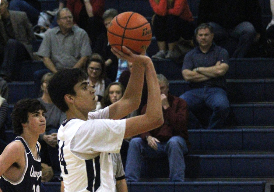 Senior Alex Peavy rises up for a free throw attempt during the Rangers matchup against the Churchill Chargers last season.