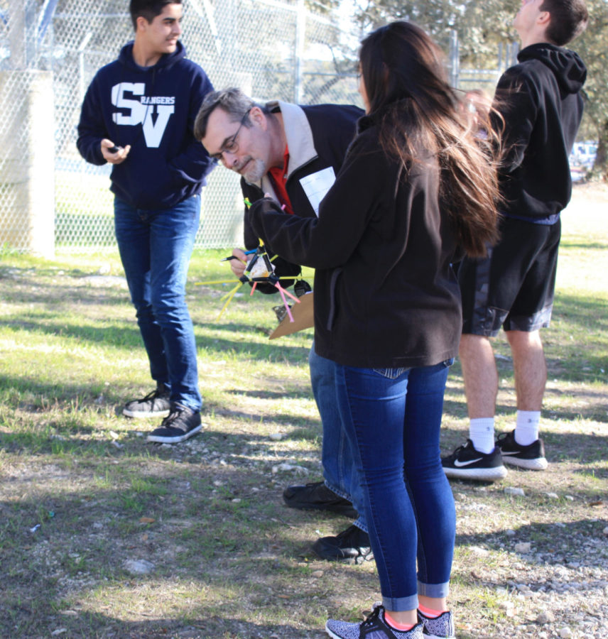 Mr. Harshbarger makes sure that Sabrina Stanley's egg wasn't cracked.