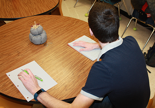 Freshman Daniel Lackey pretends to cheat on a vocab quiz.