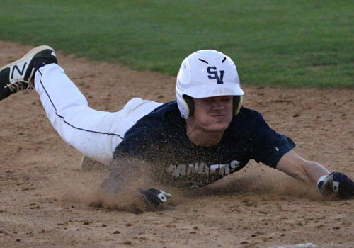 Senior Mason Pierce slides into second during the teams scrimmage versus Churchill High School last season on Feb 22.