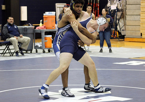 Photo of the Day: Senior Jonathan Jackson gains leverage to throw his opponent to the mat at the district 14 meet Feb. 10 in Austin. 