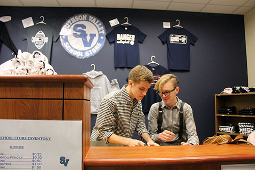 On Feb. 12, Mike Laplante and Jacob Munter go over new combo deals to offer customers in the school store during the #Plan 4 My Future night. Incoming freshmen and their parents were invited to visit with students and teachers about the various programs and classes available.
