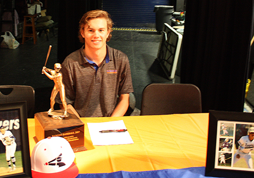 Ethan Cernohouse signs his letter of intent to play baseball at University of Mary. "It's a great school," he said. "It grabbed me and it feels like home."  