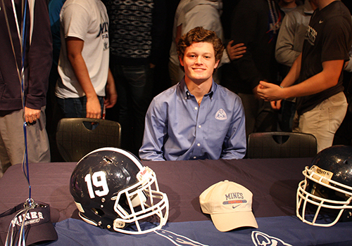 Mason Pierce poses during his signing. He will play football at Colorado School of Mines. "Academics and football both excelled there," he said
