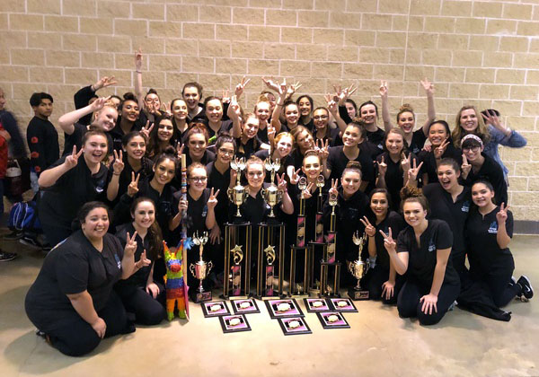 Silver Spurs dance team celebrates their victories at a former Crowd Pleasers competition.