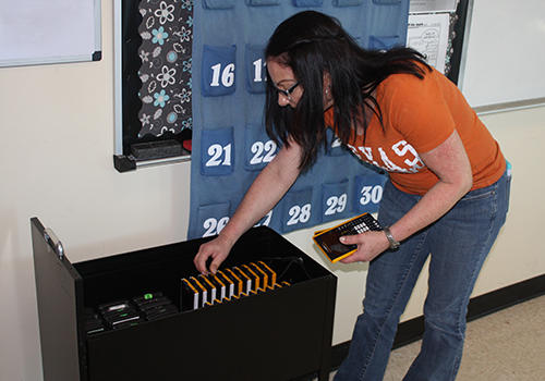 Kathryn Rutledge perfroms some quick calculations to make sure she has all of the calculators back after the in school SAT test on March 7.