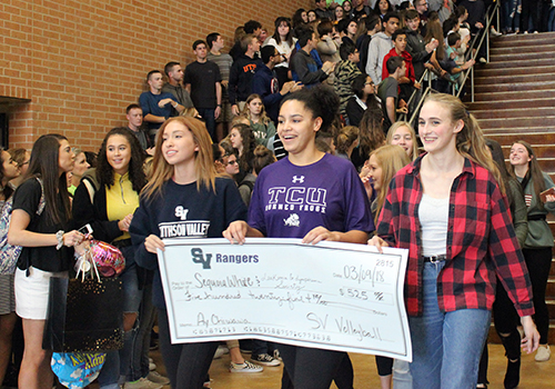 Taylor Horcasitas, Tanyse Moehrig-Woodard and Tara McLeod present the $525 donation raised during the Ay Chiwawa spirit night March 5.