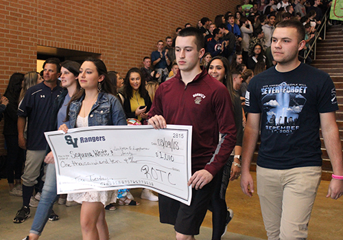 ROTC cadets Alyssa Thomas, Lynnea Seiler, Julissa Moreno, Lachlan Shipp and Seth Davidson present the ROTC's donation of $1,010 raised during Taco Tuesday.