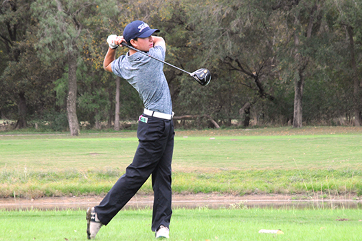 Tyler Horn hits off the tee box during the A&M invitational. Horn placed first overall in the tournament.