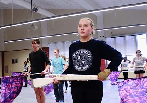 Officer Carlie Gothard gets set as she prepares to perform "Applause" with the guard. 