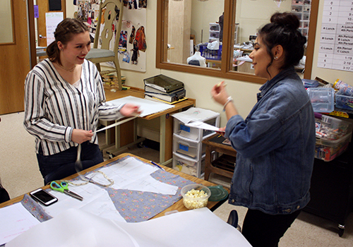 Junior Olivia Anaya and senior Bustamante make dresses for their fashion II class on April 16.