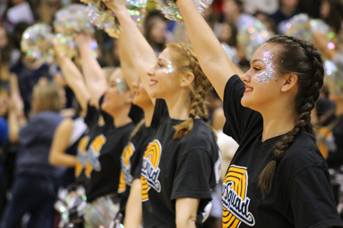 With the Silver Spurs, Tandy Folsom waves her pompoms, which match her glittery make-up.