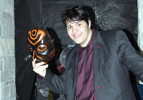 While Fall Fest rages on in the main hallway and senior dining hall, senior Marcos Gutierrez welcomes guests to the haunted house in the A Wing hallway Oct. 23.