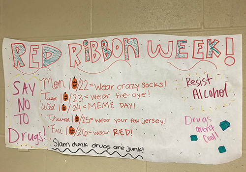 A plastered poster serves as a reminder for what to do for Red Ribbon Week.