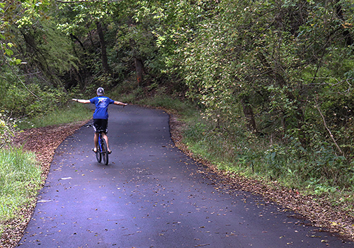 Enjoying a lazy Sunday bike ride, sophomore Dalton Wambles celebrates the freedom of a three-day weekend.