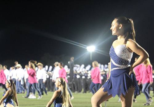While the Silverados dance with their moms at halftime Nov. 2, freshman Lauren Matula awaits the band's performance.
