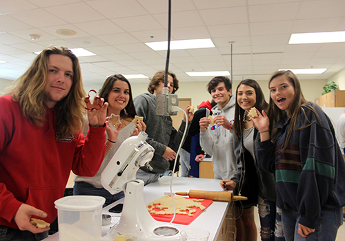 Senior Ethan Boozel, Maya Garcia, Trevor Danmeier, Bryce Petro and
Addison Garza make Christmas cookies in Katie Arp's food science class Dec. 5.
