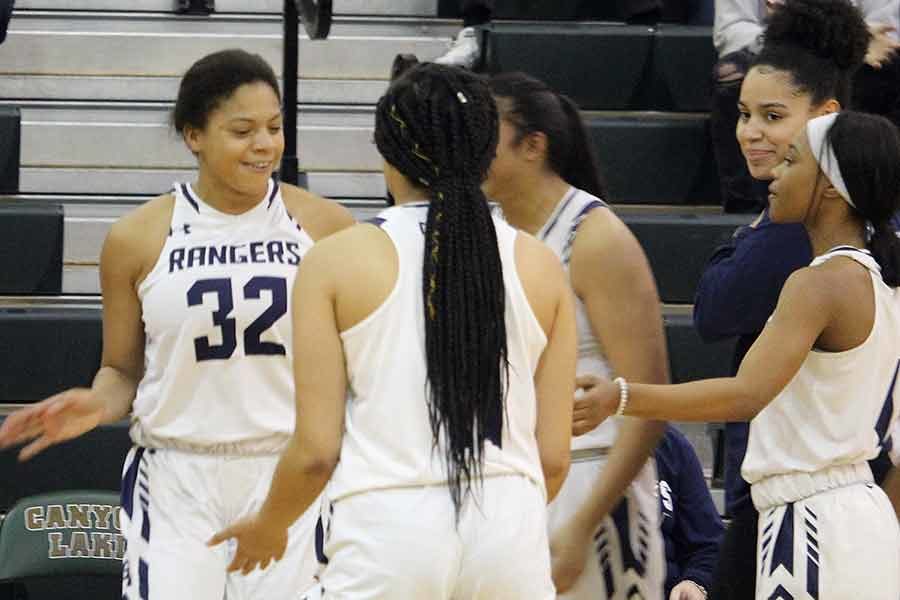 Junior Brianna Grell's teammates hype her up as she's introduced in the starting lineup. Teammate Tanyse Moehrig was sidelined from a knee injury on Jan. 8 against Judson.

