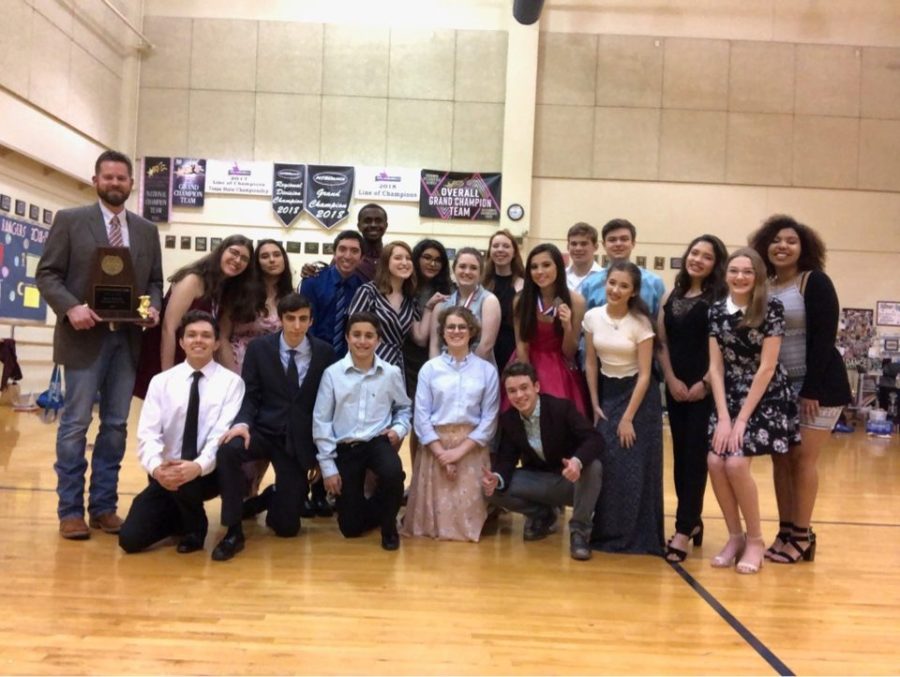 The cast and crew of "GINT" celebrate their trophies and medals along with a first place finish in district.