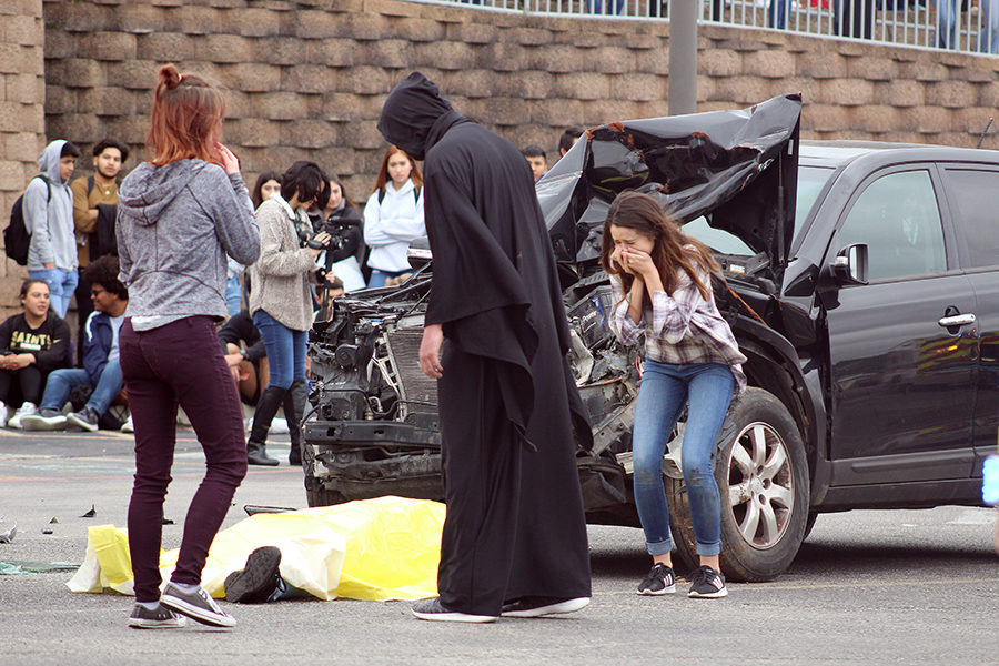 During the Shattered Dreams presentation on Thursday, accident victims cry over the dead body, played by Trey Witcher.