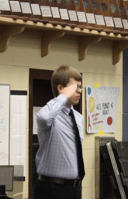 Junior David Garstecki launches his audition with the drum major salute.