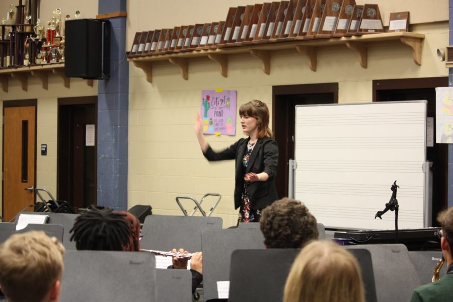 Junior oboist Rachael Waltman leads the group with the alma mater. 