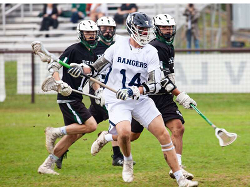 Sophomore FOGO Will Ford clearing ball toward offensive end of the field during Reagan match on April 6th at Jumbo Evans Sports Park.